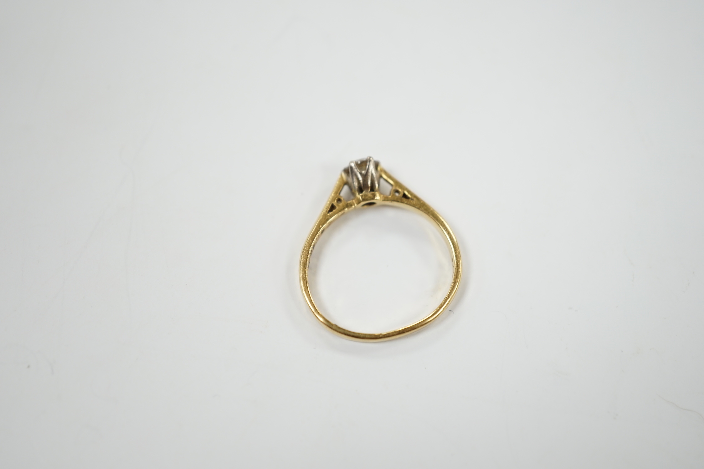 A modern 18ct gold and solitaire diamond set ring, size G/H, gross weight 1.8 grams.